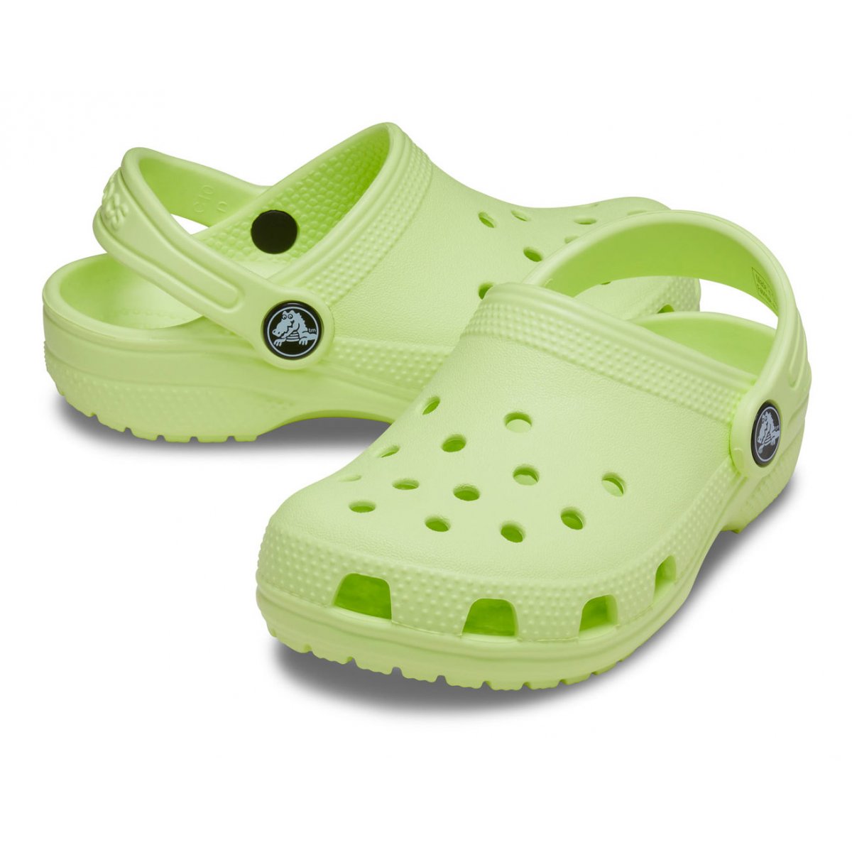 a pair of lime green crocs on a white background